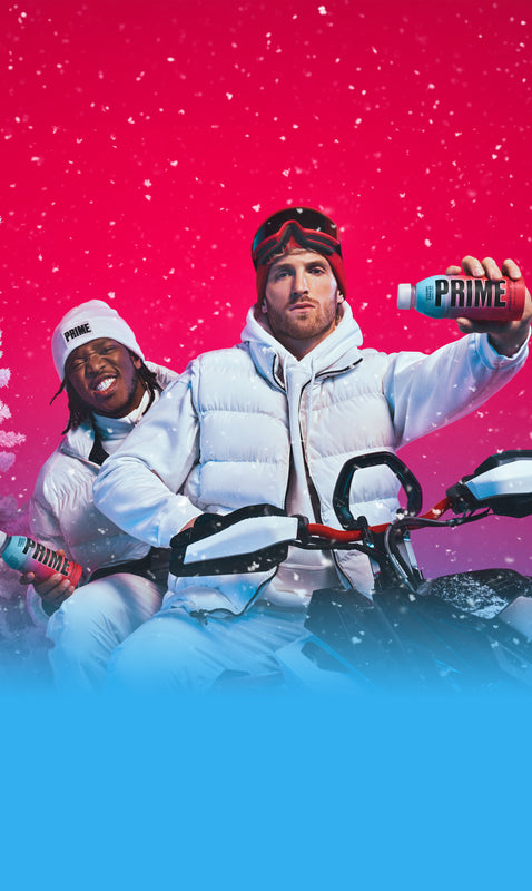 KSI and Logan Paul holding PRIME Hydration drinks while on a snowmobile.