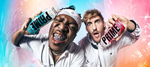 KSI and Logan Paul in front of a frosted backdrop, posing with two bottles of PRIME ICE Hydration—Blue Chill and Red Chill. 